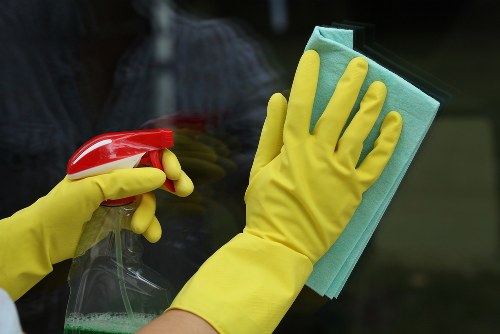 Gutter cleaning service for a Twickenham home with debris being removed